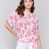 Blouse with a crew neck and floral pattern by Charlie B.