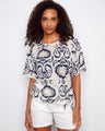 Navy and cream patterned top featuring a stylish boat neckline, perfect for a casual yet chic look by Charlie B.