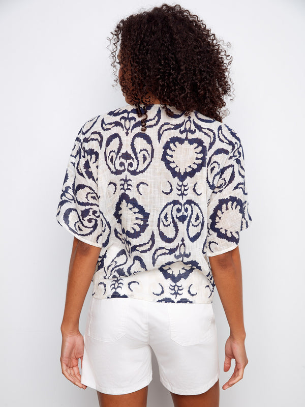 Crafted from a lightweight cotton blend, this patterned top ensures comfort and style all day long by Charlie B.