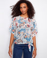Floral top featuring a stylish boat neckline, adding elegance to your casual look. Crafted for comfort and flair by Charlie B.