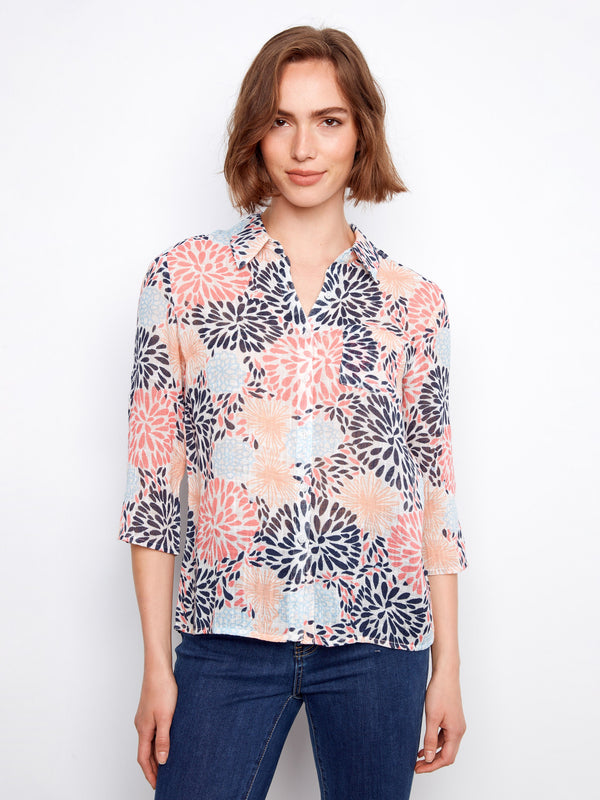 Floral shirt featuring a classic button-up style with vibrant patterns for a lively look. By Charlie B.