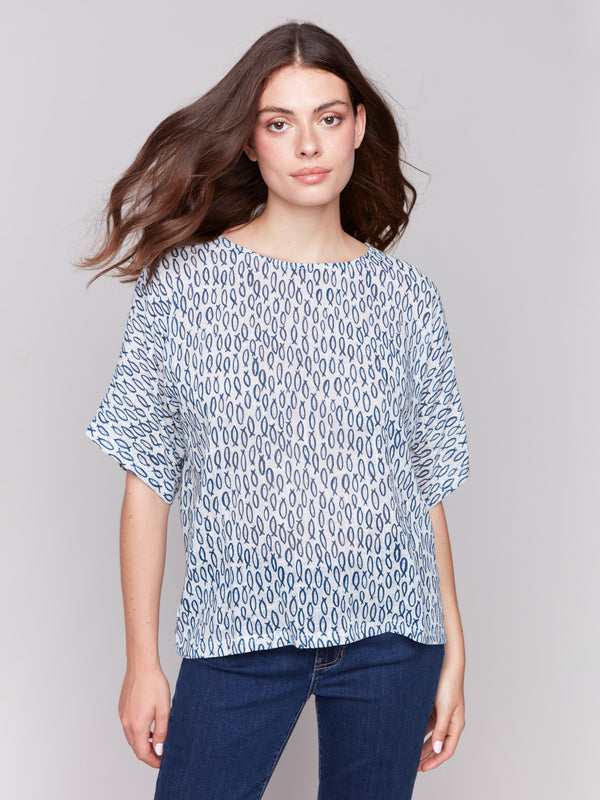 Abstract fish-patterned top with a relaxed fit by Charlie B.