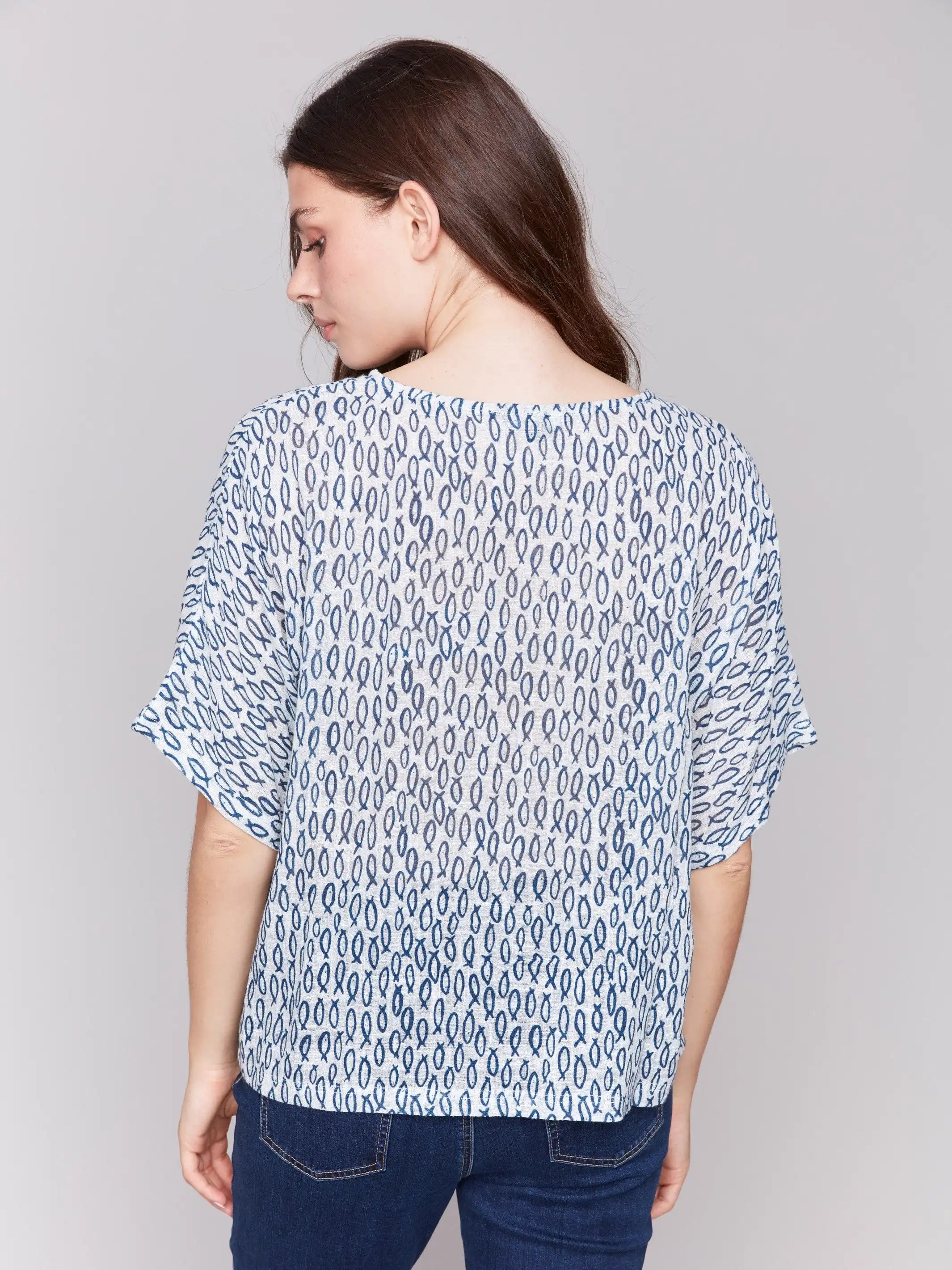 Fish-print blouse in blue with short sleeves and crew neckline by Charlie B.