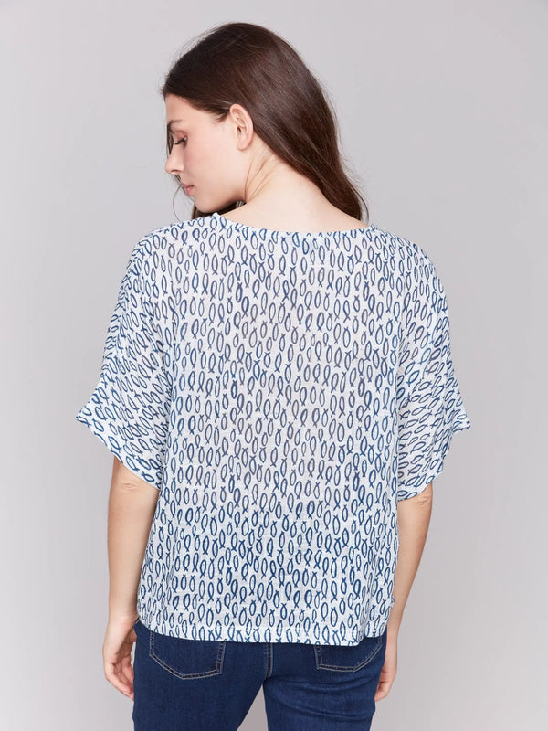 Fish-print blouse in blue with short sleeves and crew neckline by Charlie B.