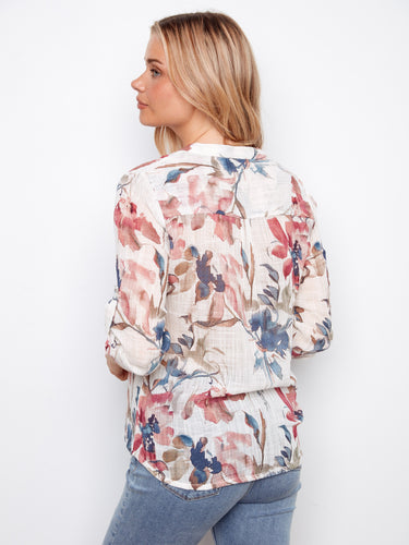 Stylish floral blouse with adjustable roll-up sleeves, ideal for adapting to various occasions by Charlie B.