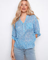 Blue patterned blouse featuring a chest pocket, creating a stylish and functional look. Perfect for casual outings by Charlie B.