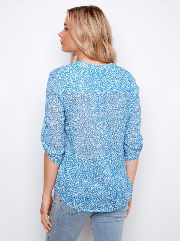 Contemporary blue top designed with attention to detail and modern aesthetics for all-day comfort. By Charlie B.