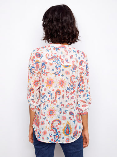 Back view of the paisley-patterned blouse highlighting its breezy fabric and relaxed fit, designed by Charlie B.