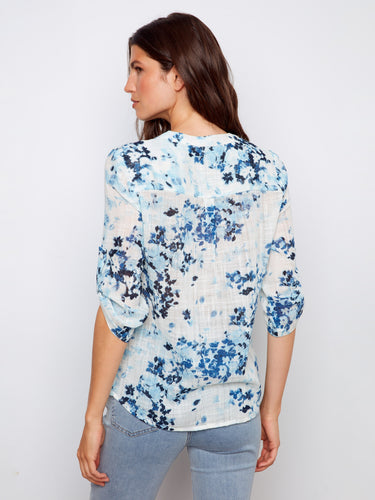 Lightweight fabric adorned with delicate florals, offering comfort and elegance in every movement. By Charlie B.
