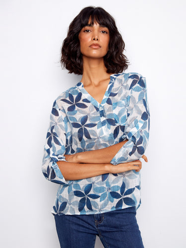 Beautifully patterned women's blouse with Henley neckline and chest pocket for added style by Charlie B.