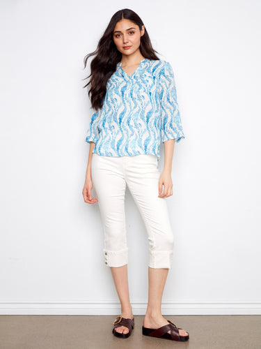 Elegant blue top with chest pocket detail, offering both style and functionality for everyday wear. By Charlie B.