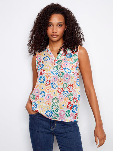 Stylish floral blouse with a convenient chest pocket, adding function to fashion in this playful design by Charlie B.