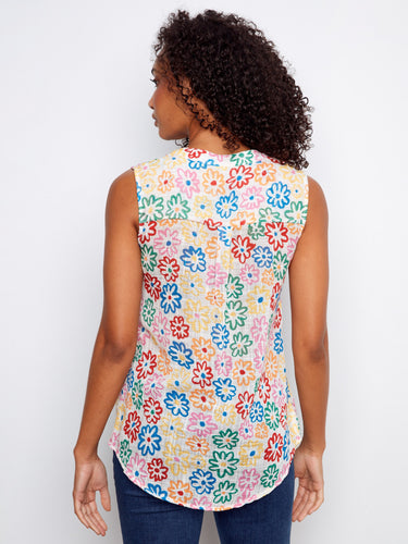 Colorful sleeveless top adorned with lively flowers, offering comfort and style for any occasion by Charlie B.