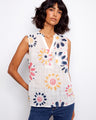 Floral top with a Henley neckline, featuring a half-button front and sleeveless design. Perfect for casual outings. By Charlie B.