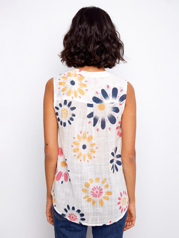 Back view of the sleeveless top showcasing the bold floral pattern that makes it stand out in any wardrobe collection. By Charlie B.