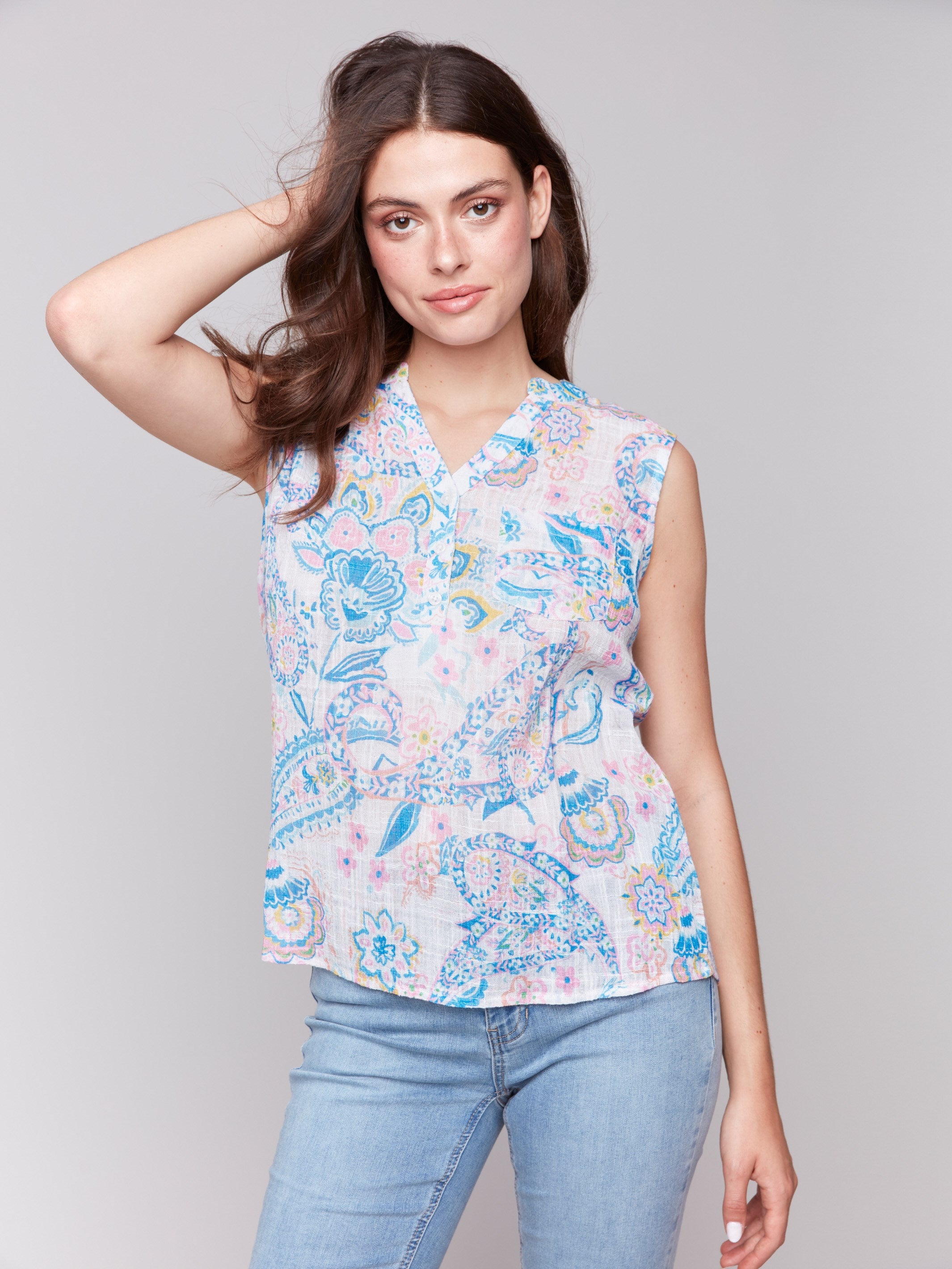 V-neck top with vibrant paisley print and sleeveless design, by Charlie B.