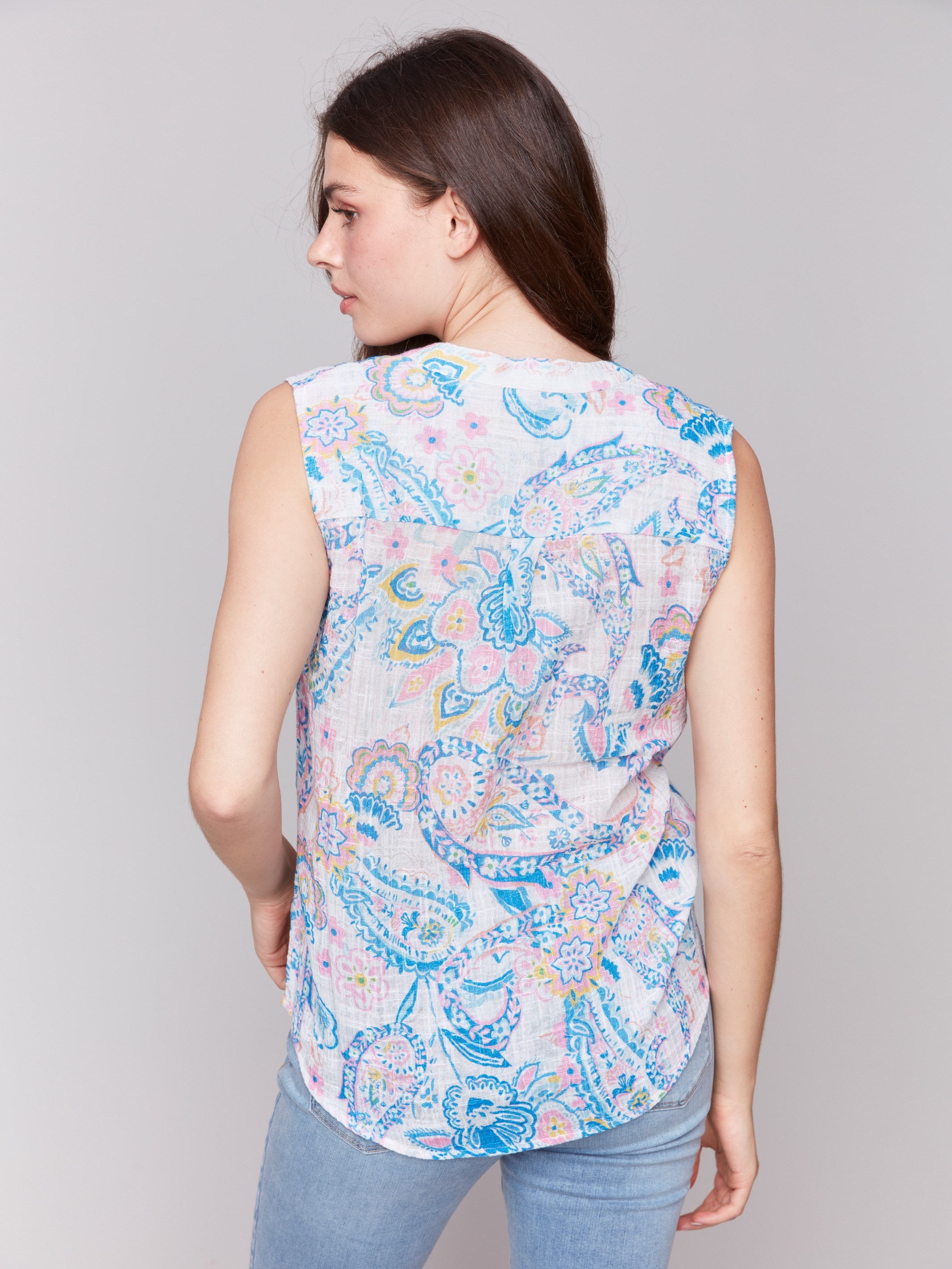 Abstract patterned sleeveless top with V-neck and high-low hem, by Charlie B.