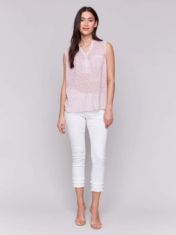 Top with chest pocket and wave-like geometric pattern by Charlie B.