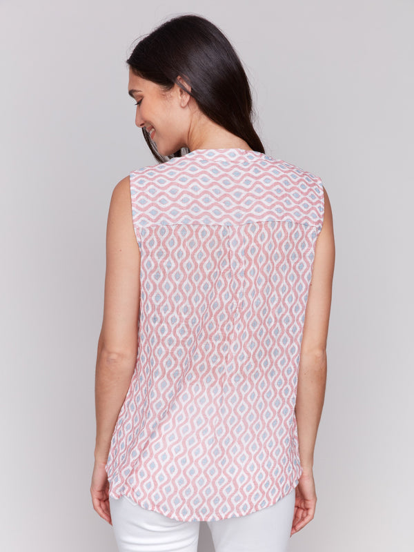 Sleeveless cotton top showcasing a high-low hem design by Charlie B.