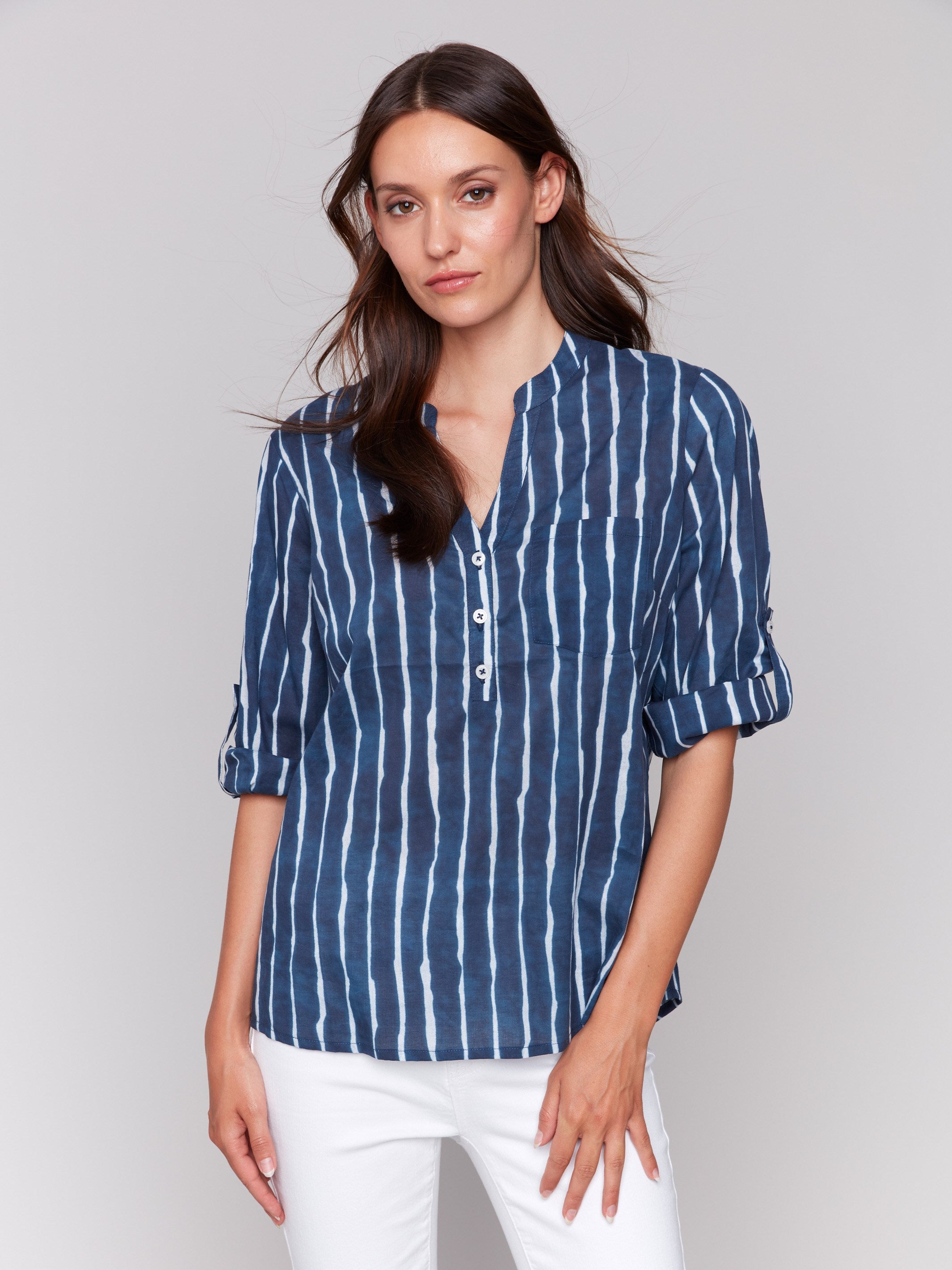 Elegant indigo striped blouse with classic design elements by Charlie B.