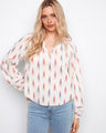 Ikat blouse featuring elastic cuffs and a rounded hem, offering a relaxed yet chic look by Charlie B.