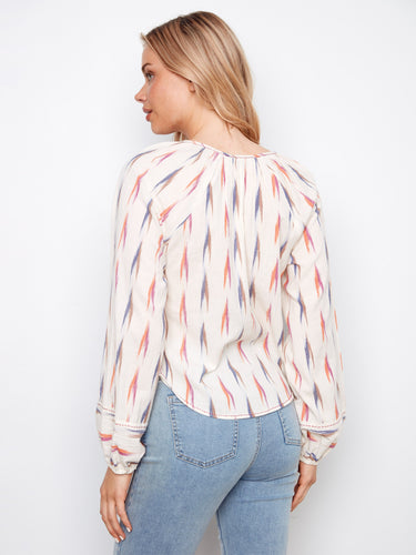 Elegant ikat print blouse showcasing a rounded hem and comfortable fit for everyday wear by Charlie B.