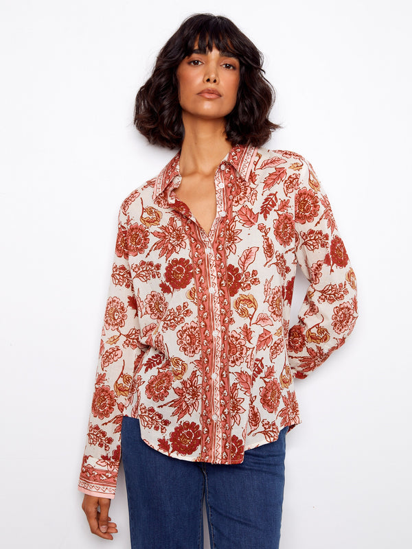 Elegant floral blouse with button-up closure and long sleeves, made from breathable cotton voile by Charlie B.