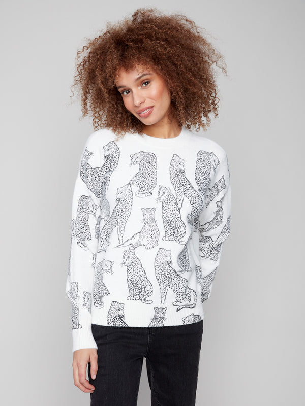 White sweater with black cheetah print showcasing a stylish crew neck design, perfect for casual outings by Charlie B.