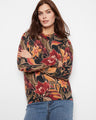 Floral sweater with a classic crew neckline, perfect for casual outings. Designed by Charlie B.
