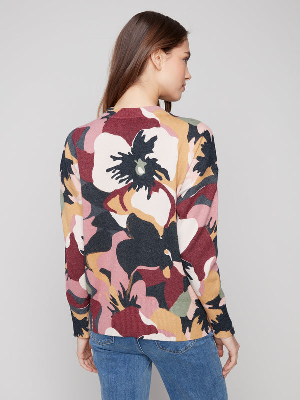 Floral patterned sweater designed with zipper details on the sleeves for added flair by Charlie B.