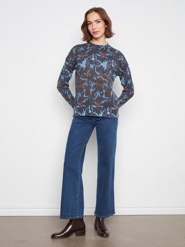 This elegant sweater boasts a drop shoulder design, offering both comfort and style for casual outings. Crafted by Charlie B.