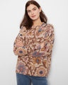 Beige sweater with floral print, featuring a crew neckline and drop shoulder design for a relaxed fit by Charlie B.