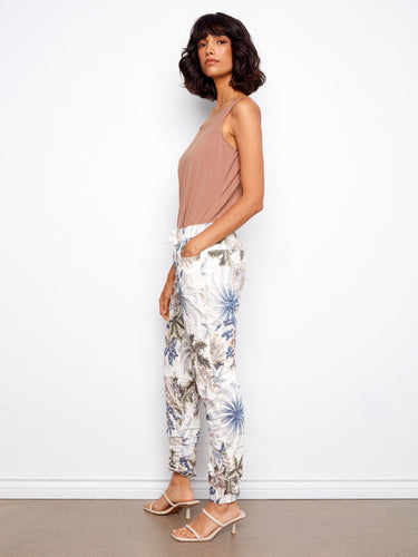 Floral printed jogger pants designed with two side pockets, combining practicality and elegance effortlessly by Charlie B.