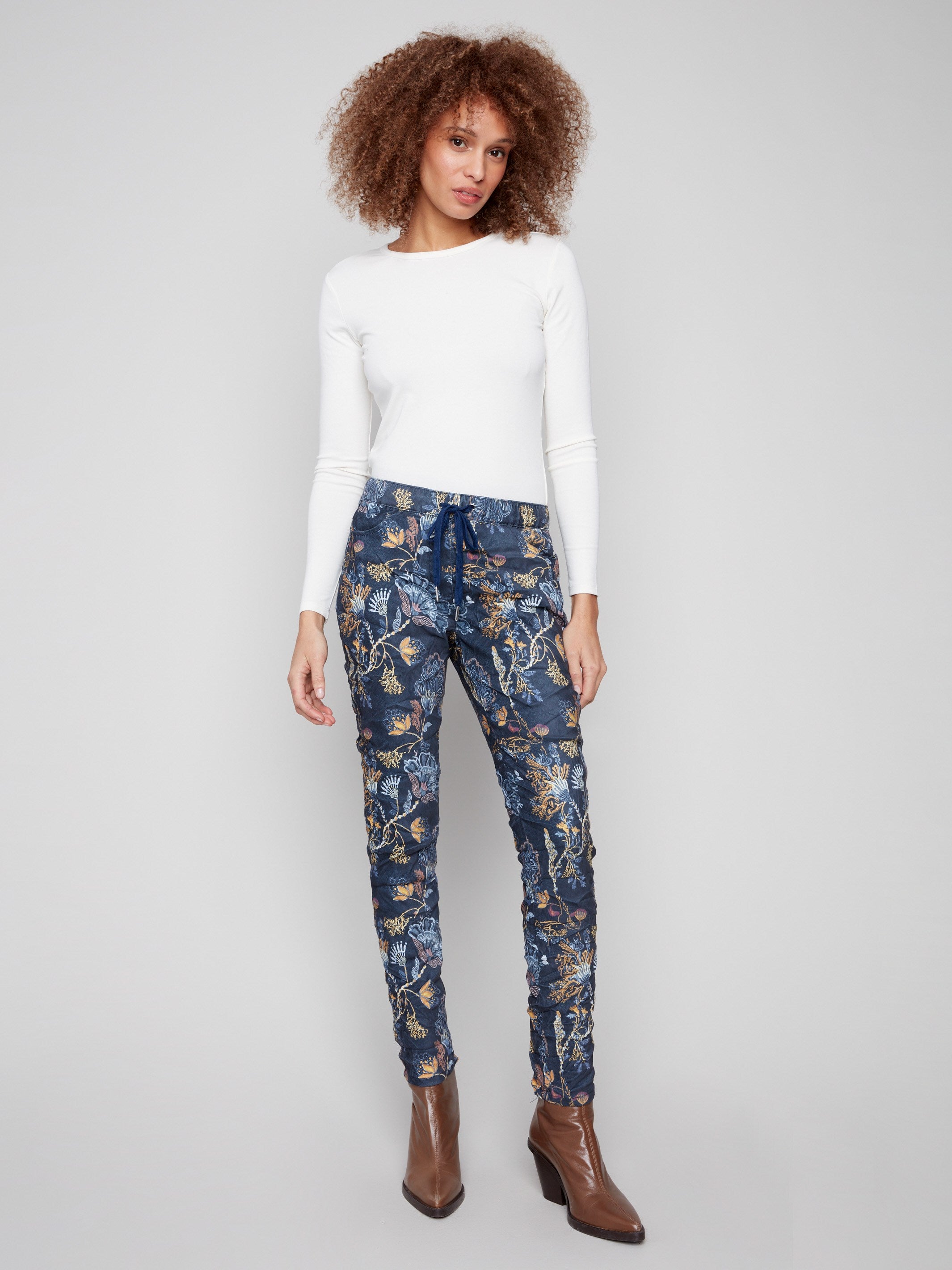 Bohemian print jogger pants with a relaxed fit and stretch fabric, showcasing an elastic waistband for comfort by Charlie B.