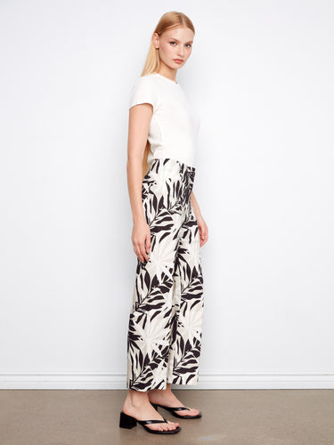 Pants with regular rise and eye-catching black and white leaf design, offering style with patch pockets by Charlie B.