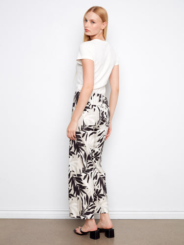 Black and white leaf print pants in a cropped length, offering comfort with a stretch linen blend by Charlie B.