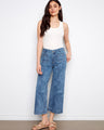 Denim jeans with a flare fit and stylish front patch pockets, offering a chic look perfect for any occasion. By Charlie B.