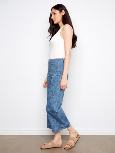 Featuring back pockets, these regular rise jeans blend functionality with fashion effortlessly. By Charlie B.