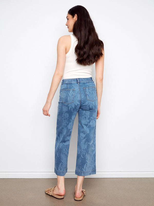 Crafted from stretch denim fabric, these jeans offer flexibility and ease of movement throughout the day. By Charlie B.