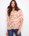 Vibrant abstract print blouse featuring a relaxed fit and lightweight cotton blend by Charlie B.