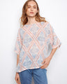 The top features a crew neckline and a relaxed fit, perfect for casual outings. Crafted in a lightweight cotton blend. By Charlie B.