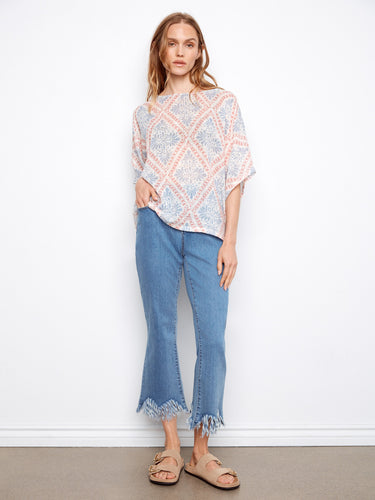 This stylish top is made from a lightweight cotton blend, offering comfort and breathability. Elbow-length dolman sleeves add flair. By Charlie B.