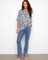 Crafted from a lightweight cotton blend, this top ensures comfort and breathability all day long. By Charlie B.