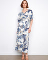 Elegant dress with a flattering V-neck and intricate pattern, emphasizing style and sophistication by Charlie B.