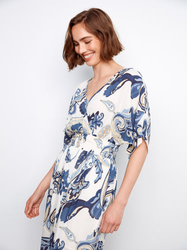 The smocked waist offers a tailored fit in this beautifully patterned maxi dress by Charlie B.