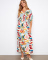 This vibrant dress features a V-neckline, adding elegance to the colorful pattern. Perfect for any occasion. By Charlie B.