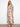 This vibrant dress features a V-neckline, adding elegance to the colorful pattern. Perfect for any occasion. By Charlie B.