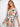 A smocked waist adds comfort and style to this floral-patterned dress, making it ideal for summer outings. By Charlie B.