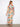 With its maxi length, this dress combines vibrant colors with an elegant flowy design for a standout look. By Charlie B.