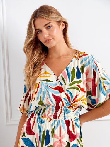 The bold print on this maxi dress captures attention while maintaining comfort and style throughout the day. By Charlie B.